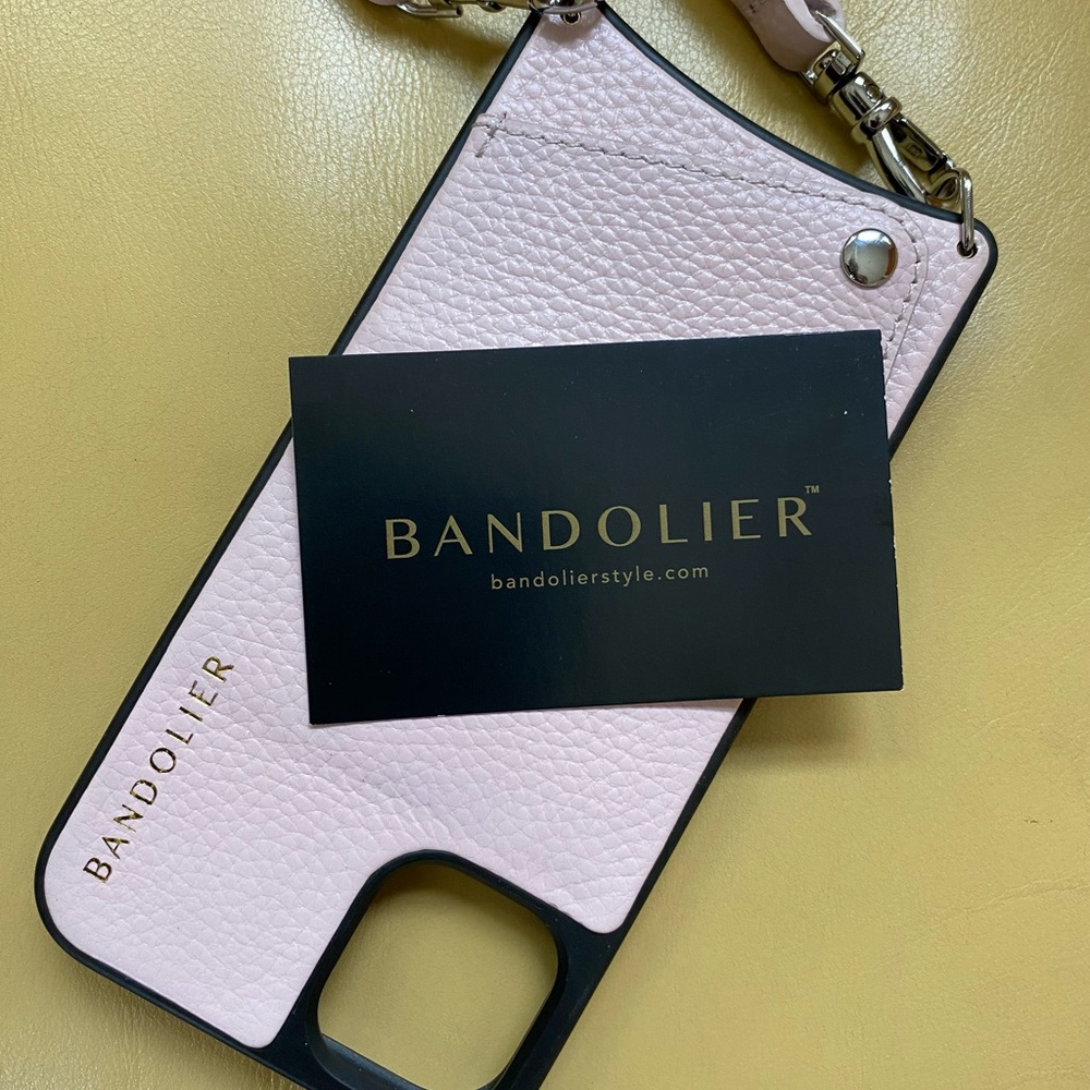 Bandolier phone in Pink.  The adjustable strap is 26” length. NMOT